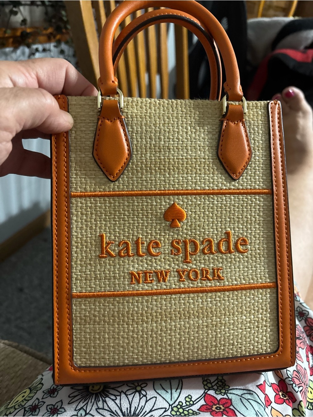 kate spade mini straw tote with orange trim and handles